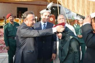 DG Rescue 1122 GB Dr. Sher Aziz honours Company Commander Sumera Liaqat with traditional turban at ESA